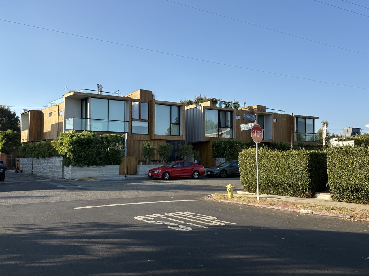 Contemporary low-rise housing at a neighborhood intersection